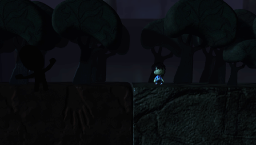A screenshot from Mansion Chapter 1 , a LittleBigPlanet Vita Scare fair contest entry level. A dark forest with a shadowy figure. 